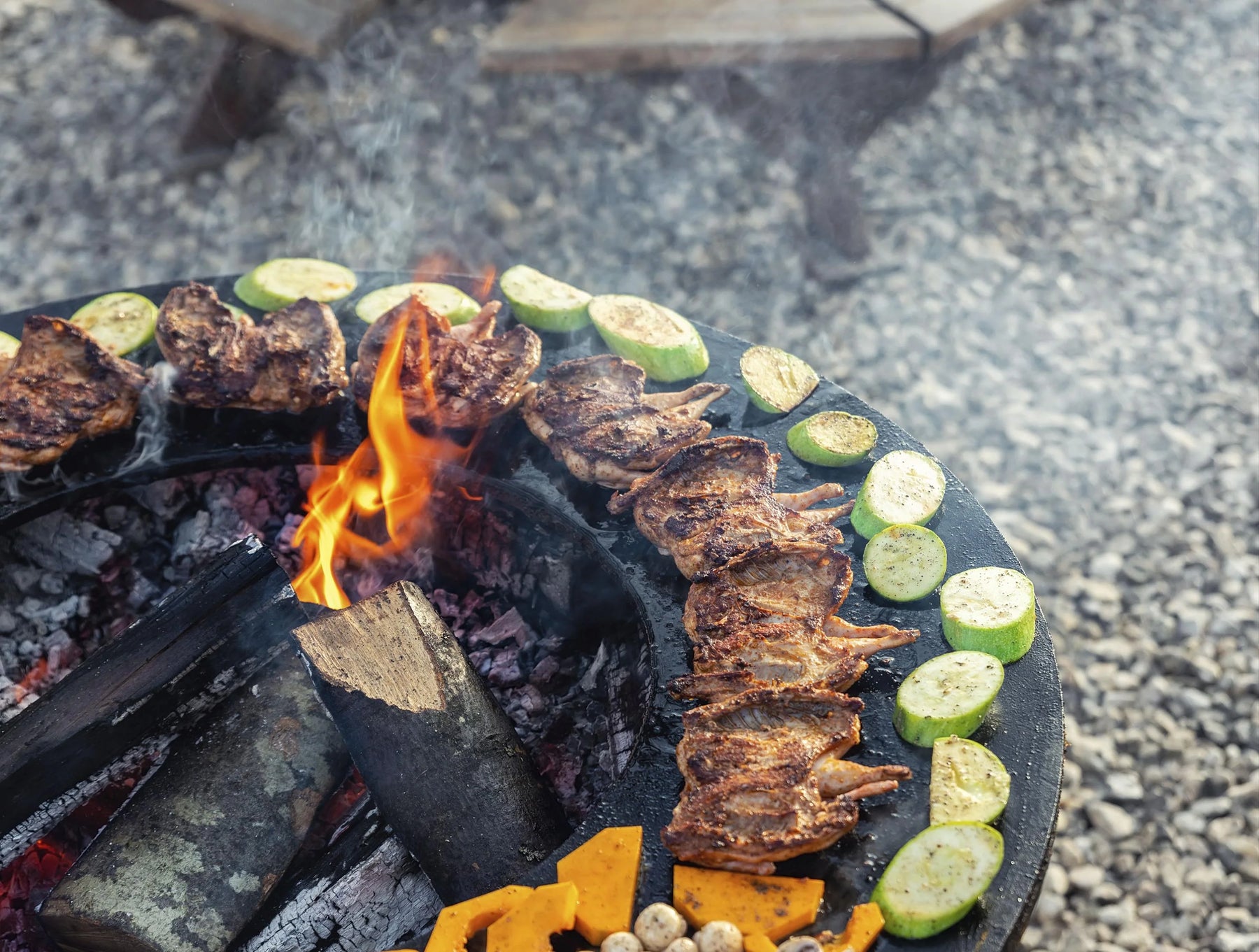 Round barbecue with round steel plate and corten steel grill -